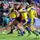 Widnes Vikings forward Rhodri Lloyd offloads the ball against Warrington Wolves in the Challenge Cup